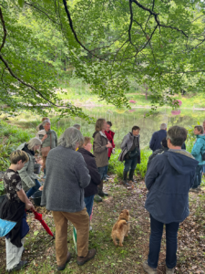 Visitors beside the pond